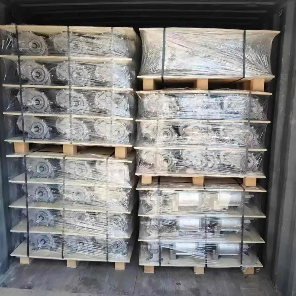 A full container of center pivot irrigation drives and wheel gearboxes, professionally packed with wooden pallets and stretch wrap.
