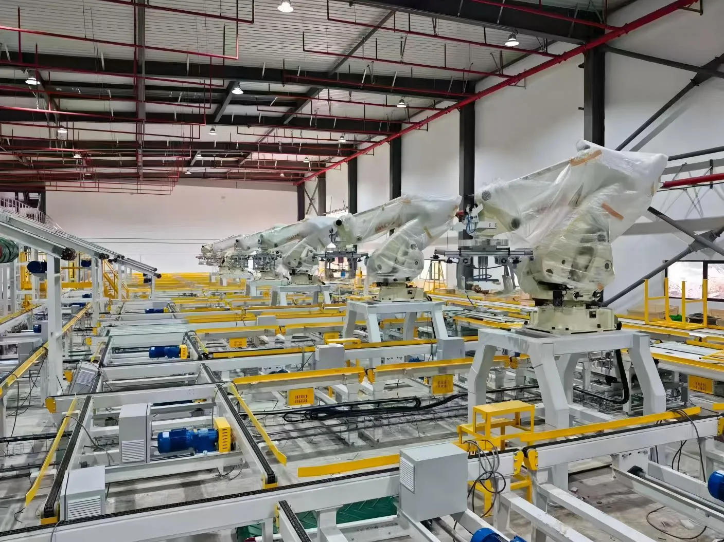 A massive intralogistics facility featuring extensive transfer units and robotic arms powered by LiuDrive gearmotors. We provide compact drives optimized for high-cycle industrial automation, sorting lines, and storage systems.