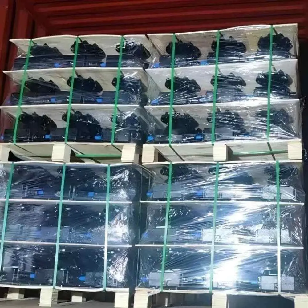 A full container of center pivot irrigation drives and wheel gearboxes, professionally packed with wooden pallets and stretch wrap.